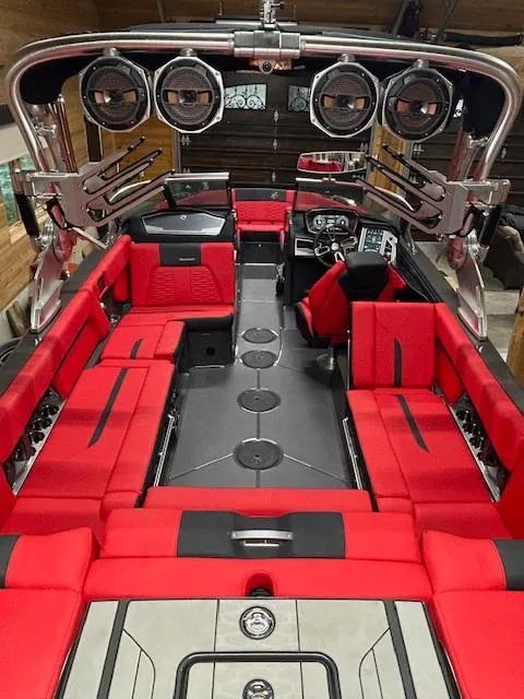 Slide: The Image of 2021 MasterCraft X24 boat with red interior and advanced sound system. - 21