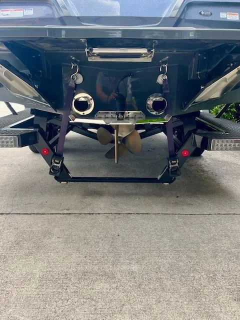 Slide: The Image of 2021 MasterCraft X24 boat stern with propeller and exhaust system visible. - 7