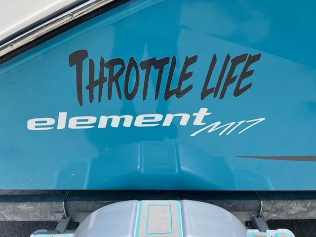 Slide: The Image of 2023 Bayliner Element M17 boat with "Throttle Life" decal on blue hull. - 4