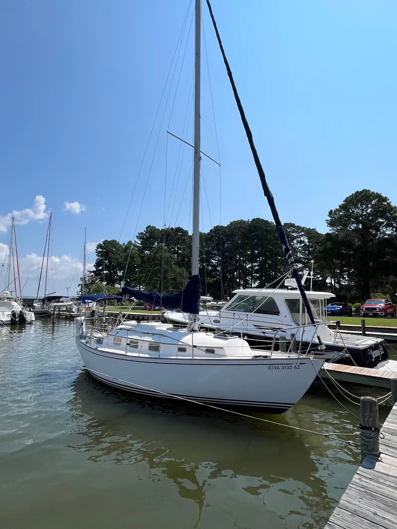 The Image of 1978 Bristol 29.9 sailboat docked at a marina on a sunny day. - 2