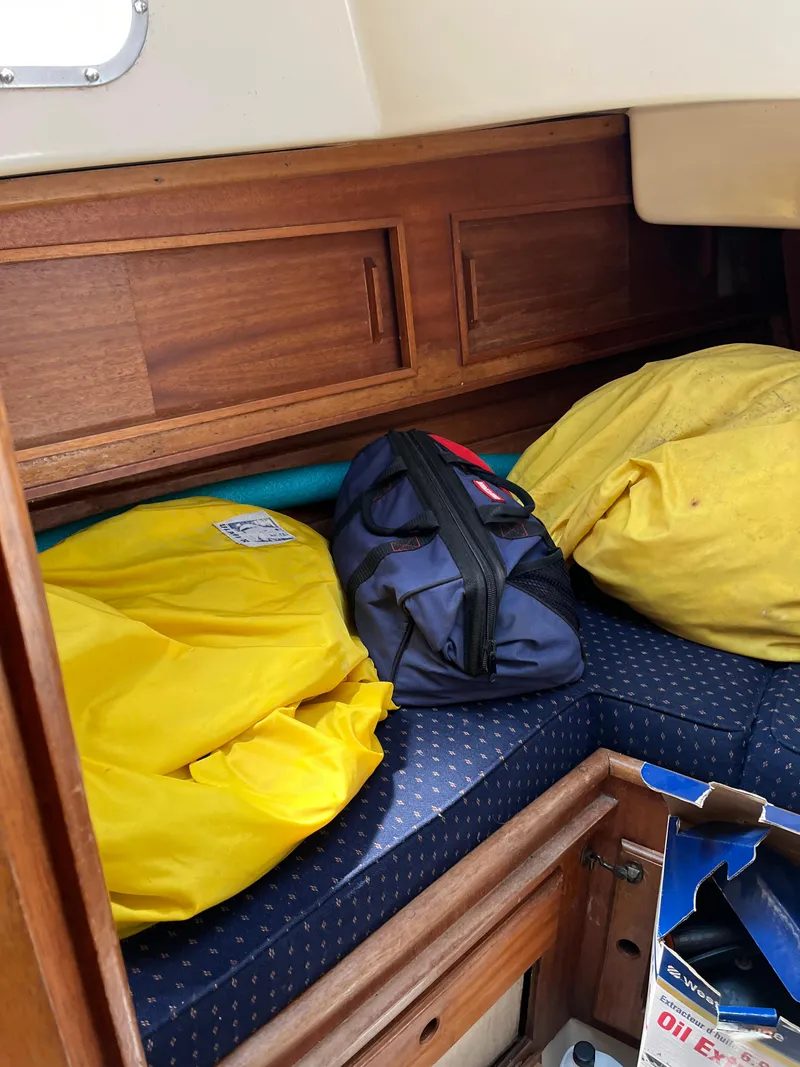 Slide: The Image of Interior of a 1978 Bristol 29.9 sailboat with yellow life jackets and a blue bag. - 22