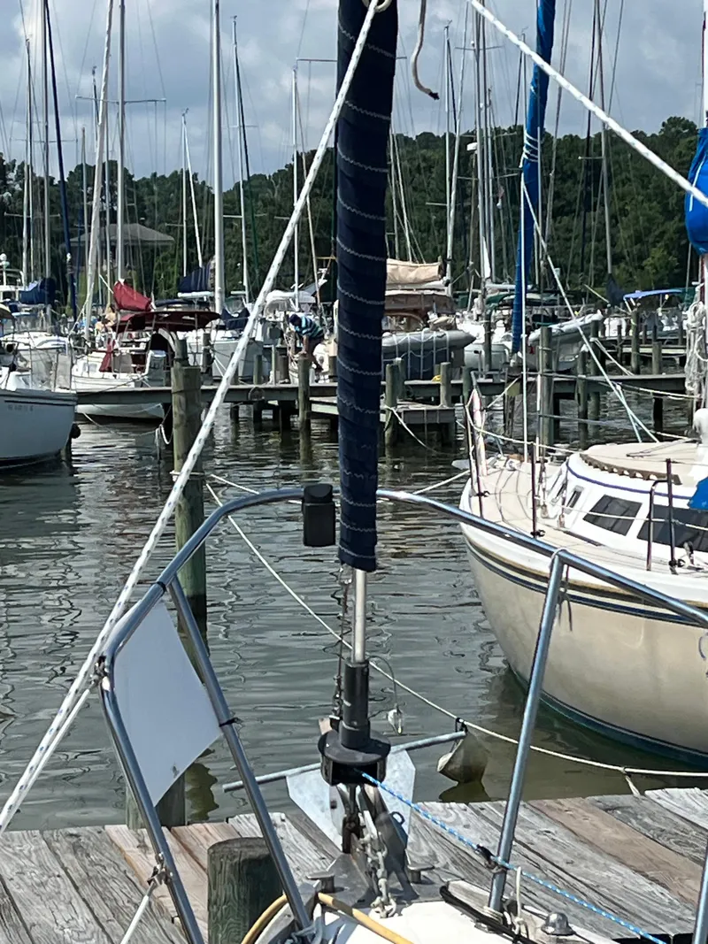 Slide: The Image of Sailboats docked at a marina, featuring a 1978 Bristol 29.9 in the foreground. - 8