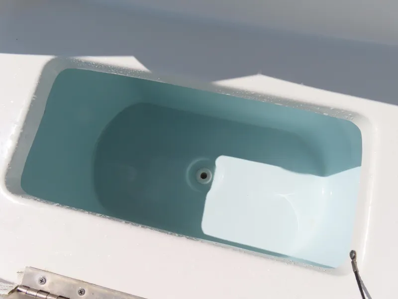 Slide: The Image of Livewell compartment on a 2016 Sea Hunt Ultra 234 boat. - 21