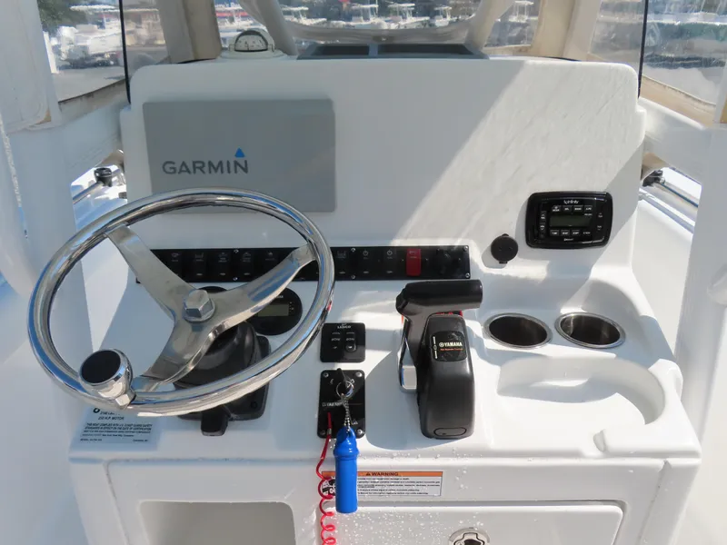 Slide: The Image of 2016 Sea Hunt Ultra 234 boat console with Garmin navigation and Yamaha controls. - 27