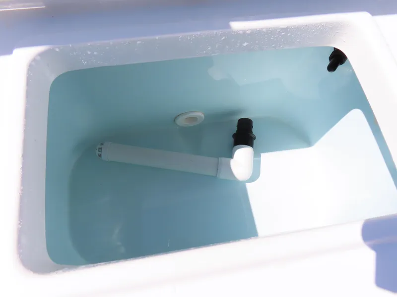 Slide: The Image of Livewell tank in 2016 Sea Hunt Ultra 234 boat, featuring plumbing and fittings. - 43