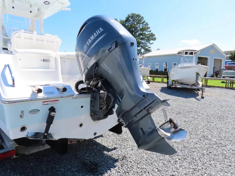 Slide: The Image of 2016 Sea Hunt Ultra 234 boat with Yamaha outboard motor on gravel lot. - 5
