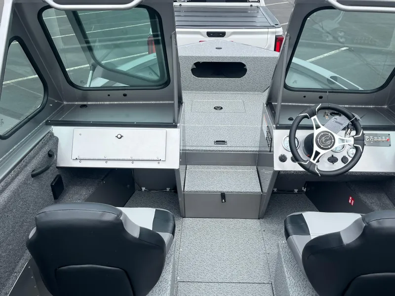 Slide: The Image of Interior of 2025 Crestliner 2050 Commander boat with steering wheel and seating. - 5