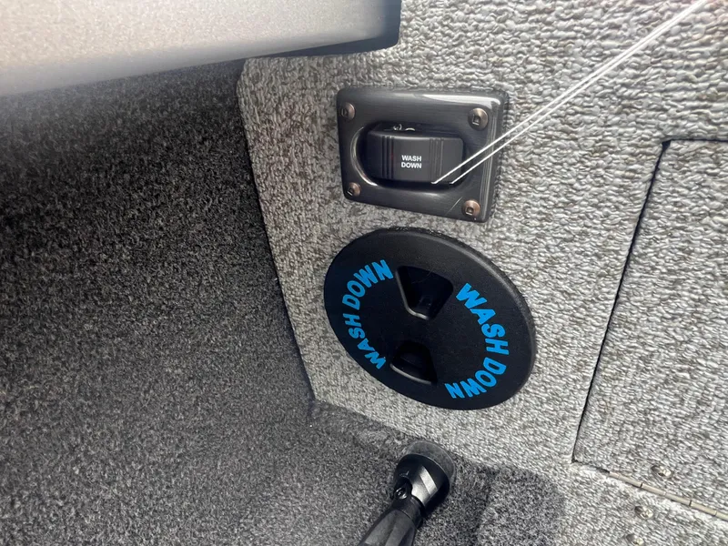 Slide: The Image of Wash down switch and outlet on 2025 Crestliner 2050 Commander boat interior. - 7