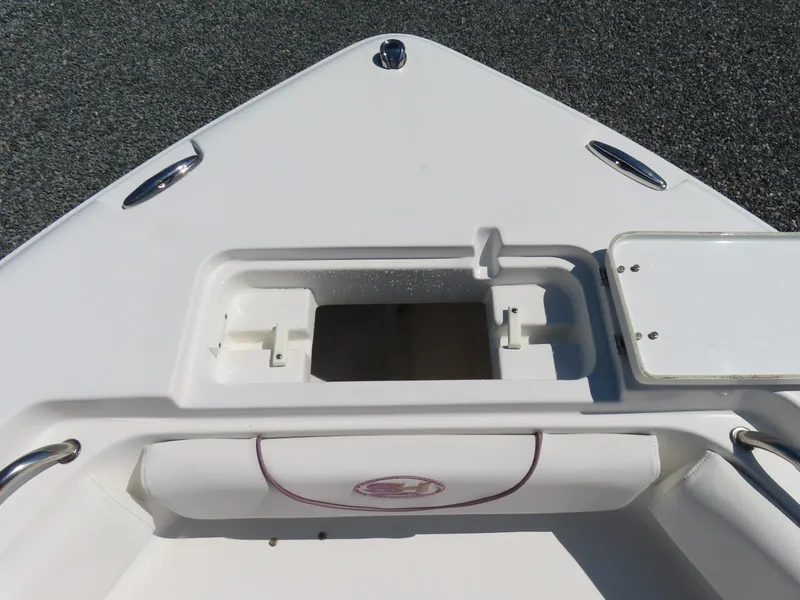 Slide: The Image of Bow of 2019 Sea Hunt Ultra 234 boat with storage compartment. - 11