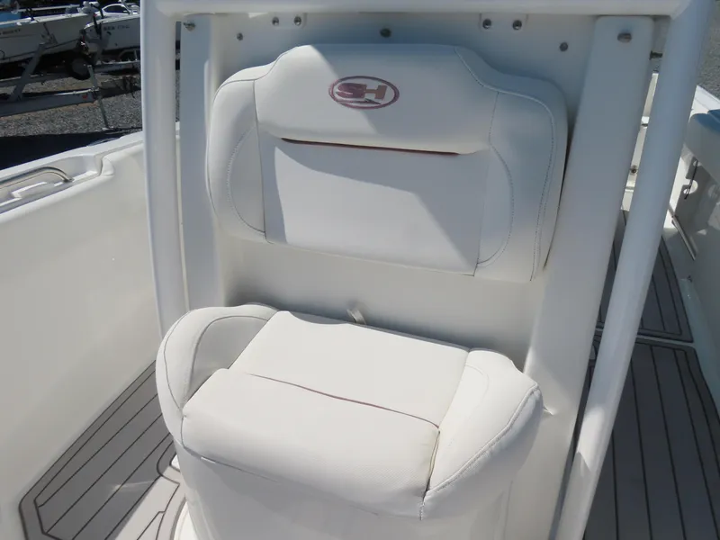 Slide: The Image of 2019 Sea Hunt Ultra 234 boat seat with white upholstery and logo. - 15