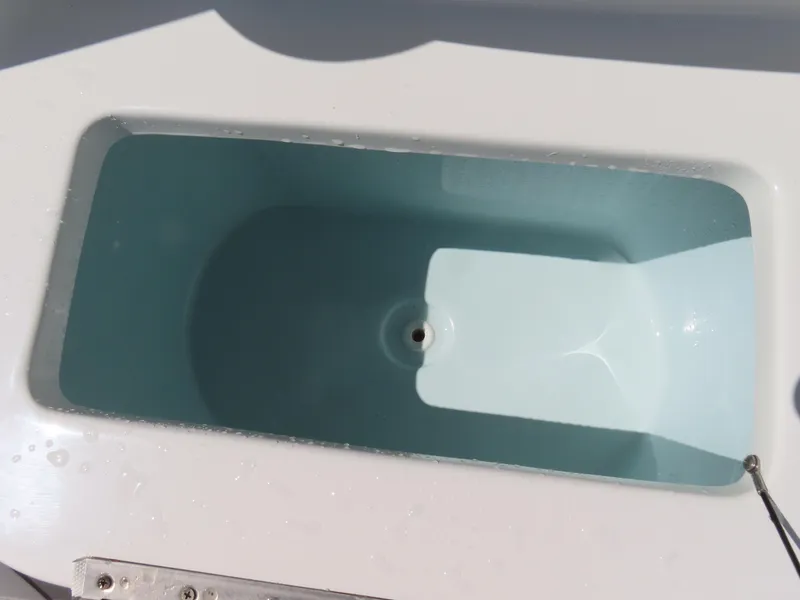 Slide: The Image of Livewell on 2019 Sea Hunt Ultra 234 boat, empty and clean. - 16