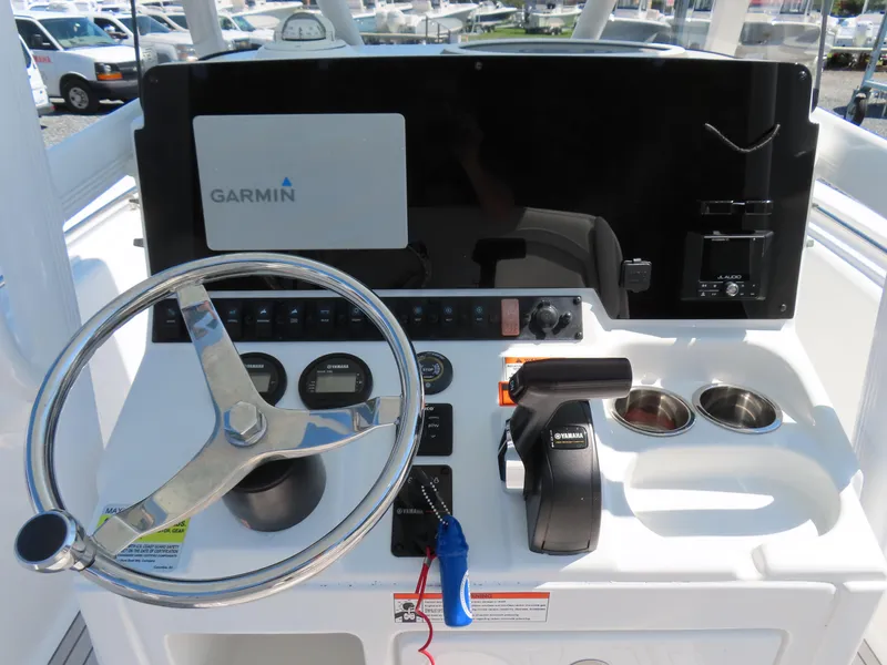 Slide: The Image of 2019 Sea Hunt Ultra 234 helm with Garmin display and Yamaha controls. - 22