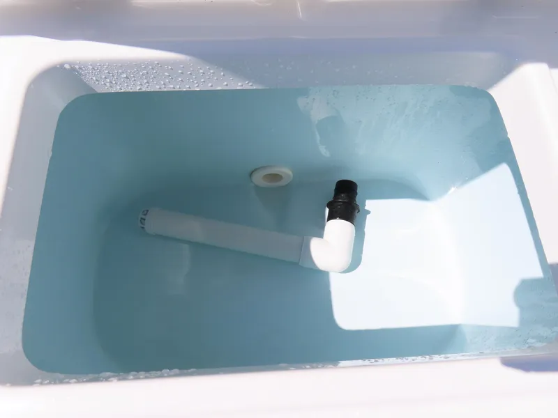 Slide: The Image of Livewell tank in 2019 Sea Hunt Ultra 234 boat, partially filled with water. - 38