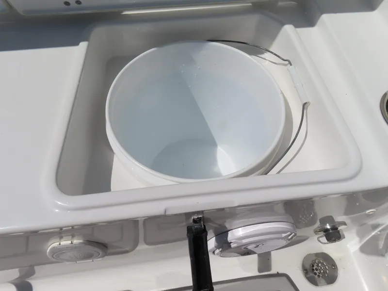 Slide: The Image of 2019 Sea Hunt Ultra 234 boat with built-in storage compartment and bucket. - 39