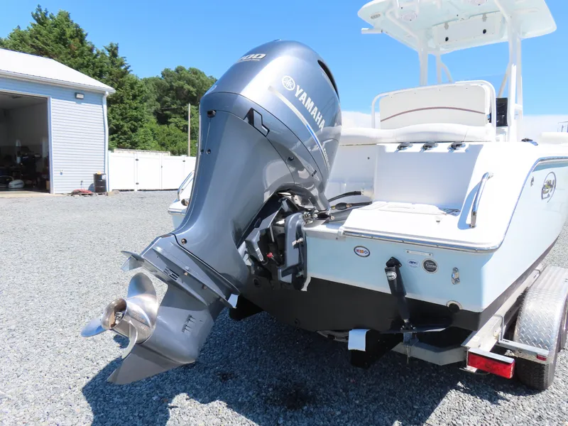 Slide: The Image of 2019 Sea Hunt Ultra 234 boat with Yamaha outboard motor on a trailer. - 5
