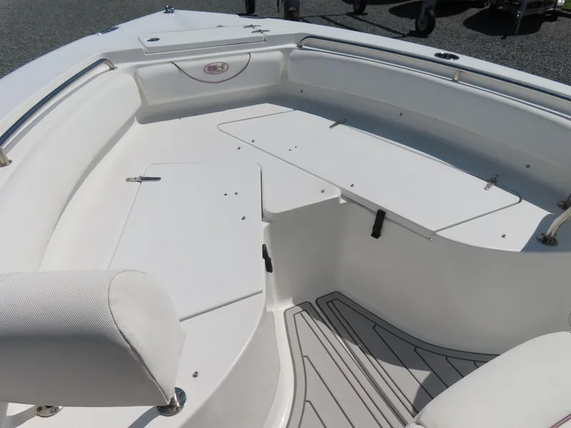 Slide: The Image of 2019 Sea Hunt Ultra 234 boat interior with seating and storage compartments. - 8