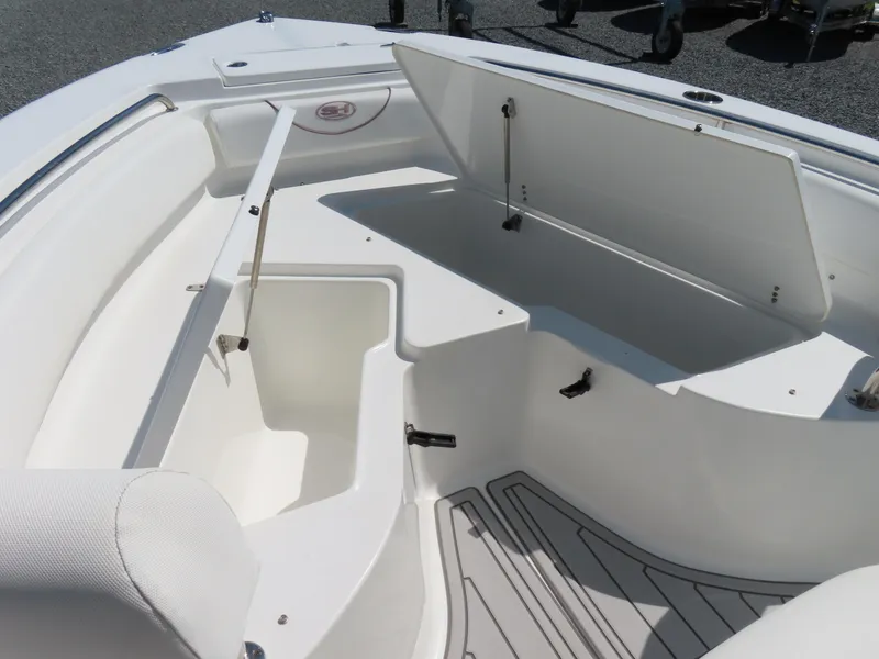 Slide: The Image of 2019 Sea Hunt Ultra 234 boat interior with open storage compartments. - 9