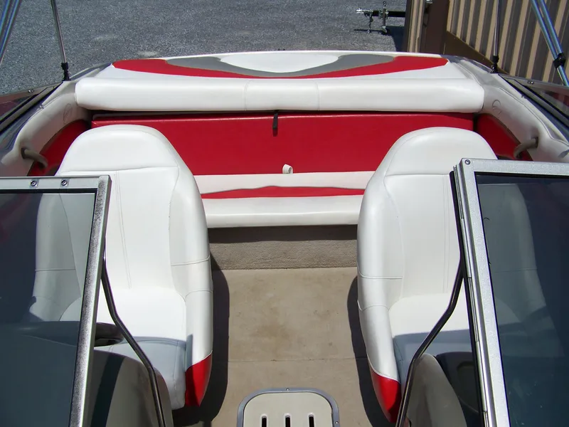 Slide: The Image of Interior of a 2001 Crownline 180 BR boat with white and red seating. - 8