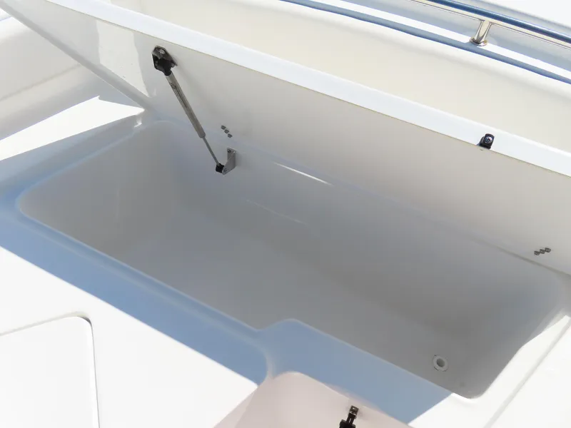 Slide: The Image of Open storage compartment on 2023 Sea Hunt Ultra 229 boat. - 10