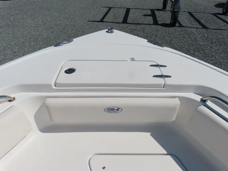 Slide: The Image of 2023 Sea Hunt Ultra 229 boat deck with storage compartment and seating. - 11