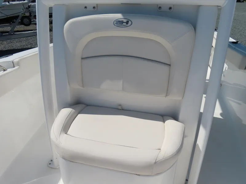 Slide: The Image of 2023 Sea Hunt Ultra 229 boat seat with white cushioned design. - 16