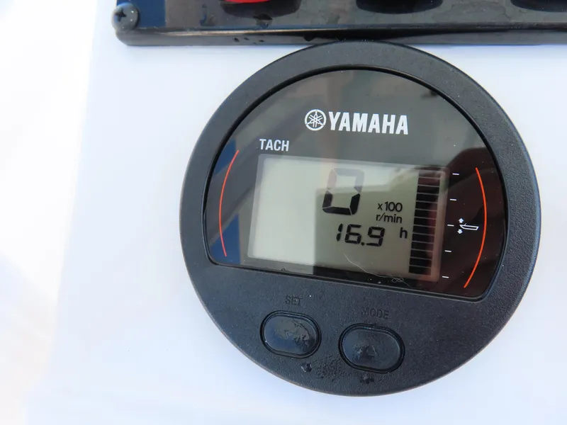 Slide: The Image of Yamaha tachometer on 2023 Sea Hunt Ultra 229, displaying 16.9 hours. - 25