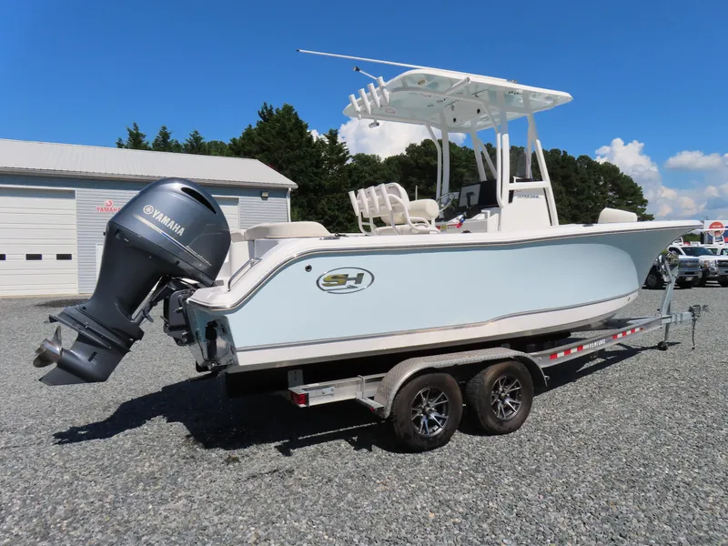 Slide: The Image of 2023 Sea Hunt Ultra 229 boat on trailer with Yamaha outboard motor. - 3