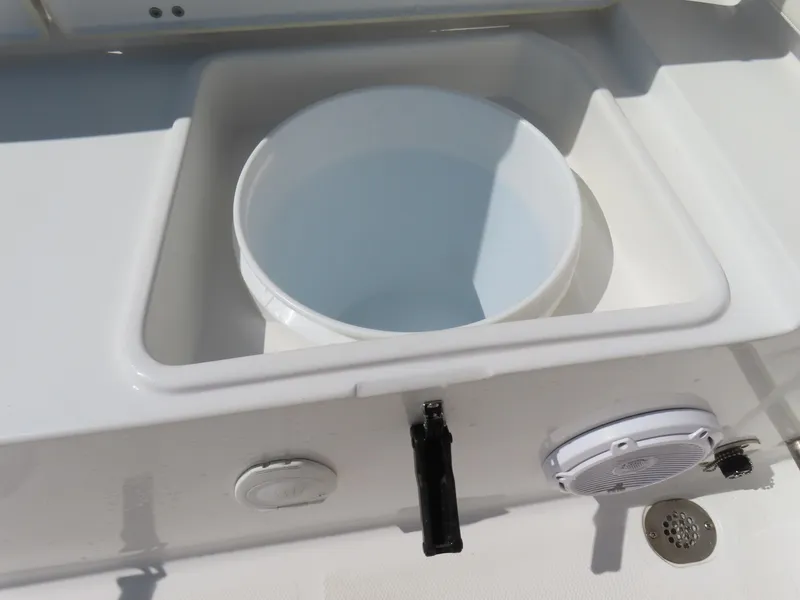 Slide: The Image of 2023 Sea Hunt Ultra 229 boat detail with built-in storage and speaker. - 34