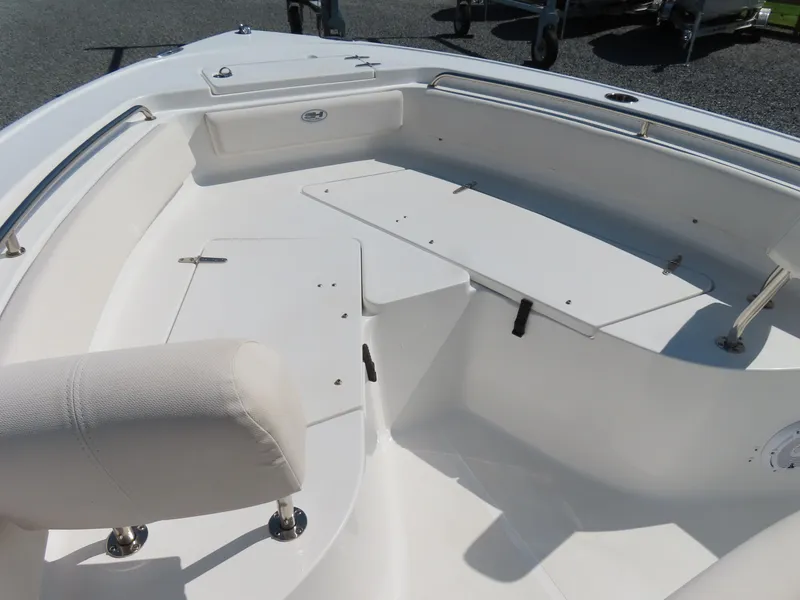 Slide: The Image of 2023 Sea Hunt Ultra 229 boat interior with seating and storage compartments. - 7