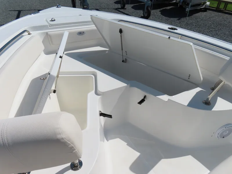 Slide: The Image of 2023 Sea Hunt Ultra 229 boat interior with open storage compartments. - 8