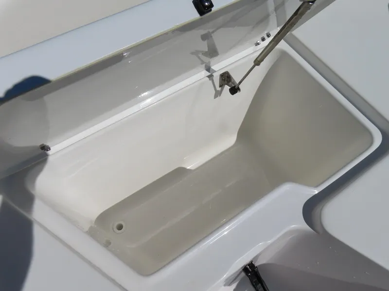 Slide: The Image of Open storage compartment on a 2023 Sea Hunt Ultra 229 boat. - 9