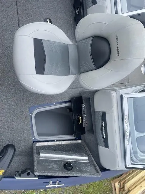 Slide: The Image of 2019 Tracker Pro Guide V-175 Combo boat interior with seating and storage compartment. - 12