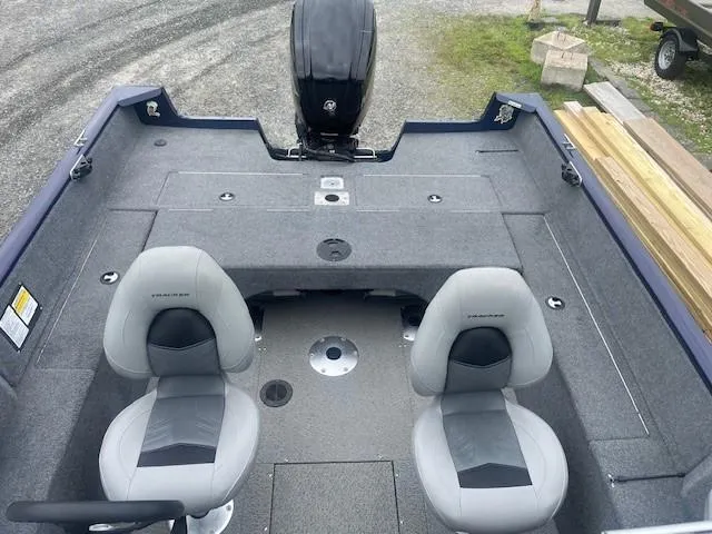 Slide: The Image of 2019 Tracker Pro Guide V-175 Combo boat interior with two seats and motor. - 13