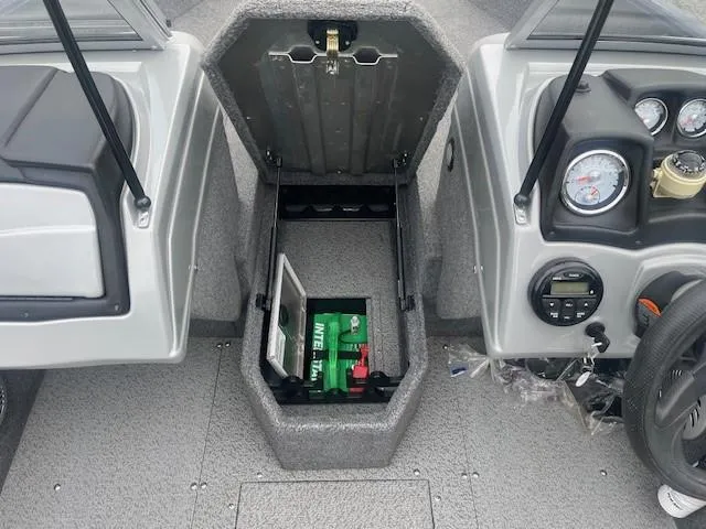 Slide: The Image of 2019 Tracker Pro Guide V-175 Combo boat interior with open storage compartment and battery. - 14