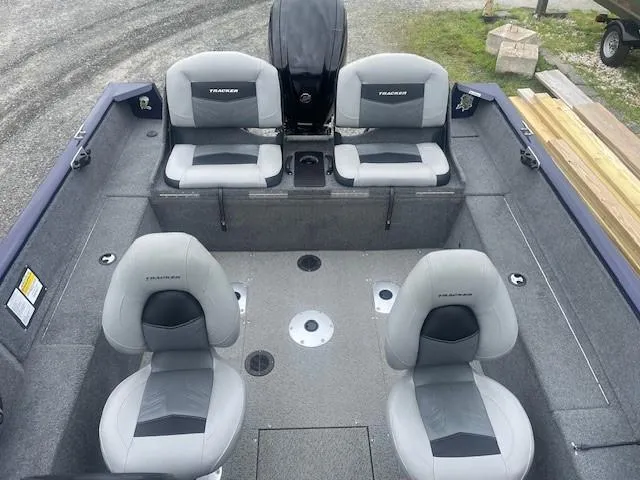 Slide: The Image of 2019 Tracker Pro Guide V-175 Combo boat interior with four gray seats. - 15