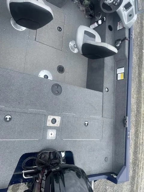 Slide: The Image of 2019 Tracker Pro Guide V-175 Combo boat interior with seating and control panel. - 16