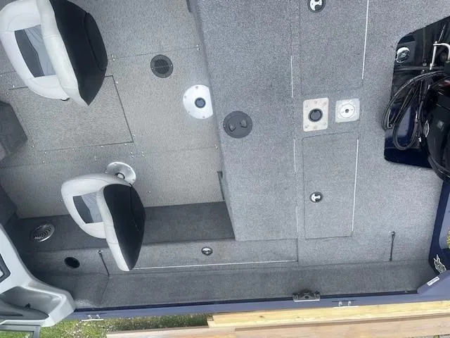 Slide: The Image of 2019 Tracker Pro Guide V-175 Combo boat interior with seating and storage compartments. - 17