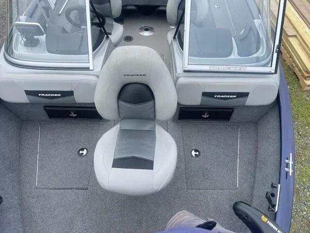 Slide: The Image of 2019 Tracker Pro Guide V-175 Combo boat interior with seating and console view. - 21