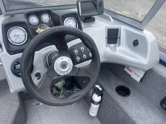 Slide: The Image of 2019 Tracker Pro Guide V-175 Combo boat dashboard with steering wheel and gauges. - 23