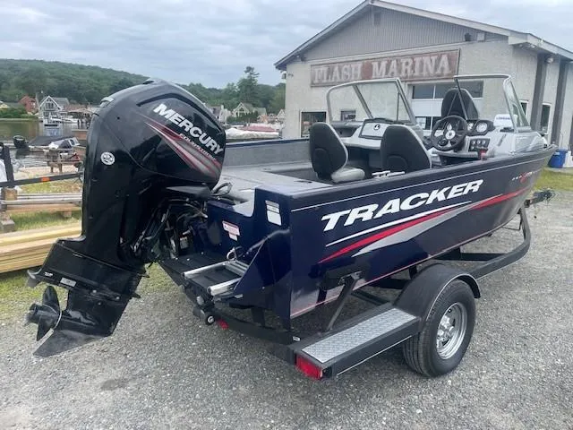 Slide: The Image of 2019 Tracker Pro Guide V-175 Combo boat with Mercury engine at marina. - 3