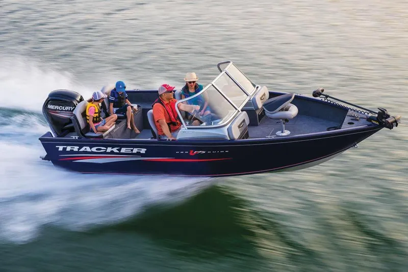 Slide: The Image of 2019 Tracker Pro Guide V-175 Combo boat speeding on water with passengers. - 37