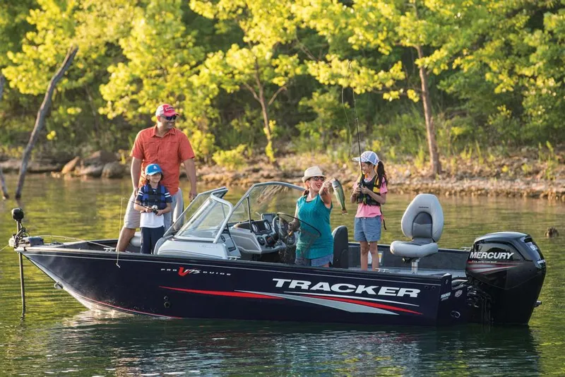 Slide: The Image of Family fishing on a 2019 Tracker Pro Guide V-175 Combo boat in a scenic lake. - 41