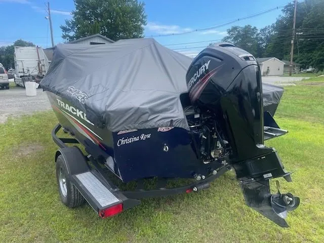Slide: The Image of 2019 Tracker Pro Guide V-175 Combo boat with cover and Mercury outboard motor on trailer. - 7