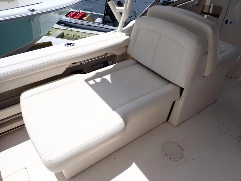 Slide: The Image of 2019 Grady-White Freedom 275 boat with a comfortable, adjustable lounge seat. - 15