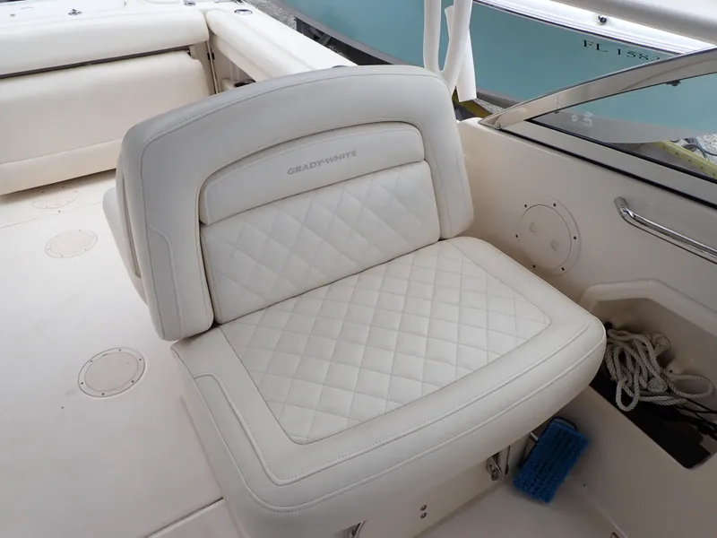 Slide: The Image of 2019 Grady-White Freedom 275 boat with white cushioned seating. - 39