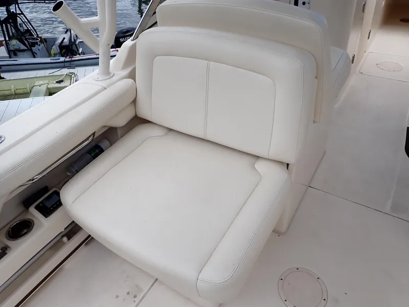 Slide: The Image of 2019 Grady-White Freedom 275 boat interior seating with white upholstery. - 41