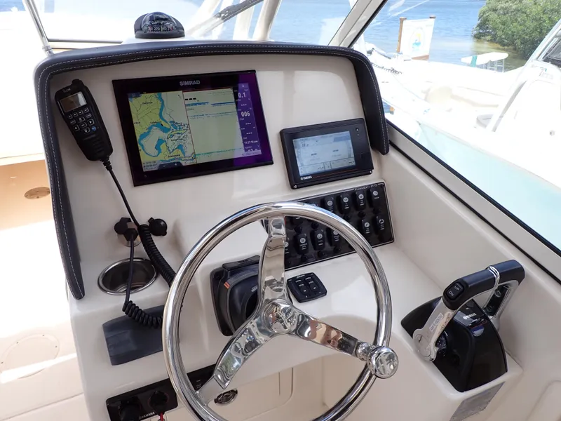Slide: The Image of 2019 Grady-White Freedom 275 helm with navigation system and controls. - 9