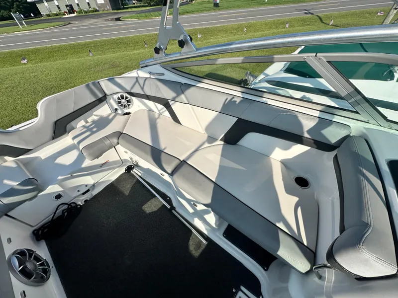 Slide: The Image of Interior of a 2012 Yamaha Boats 212X, featuring spacious seating and modern design. - 13