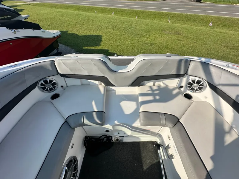 Slide: The Image of Interior of a 2012 Yamaha Boats 212X, featuring spacious seating and built-in speakers. - 14