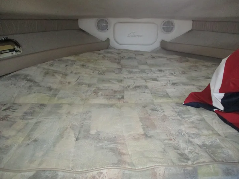 Slide: The Image of Interior cabin of 1998 Bayliner 2855 Ciera Sunbridge with patterned bedding and pillows. - 15
